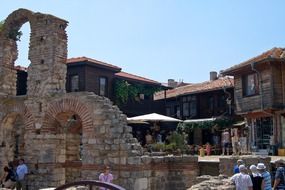 people at ruin of old church, bulgaria