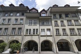 old grey building with arches, switzerland, bern
