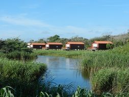 row of wooden buildings on riverside, portugal