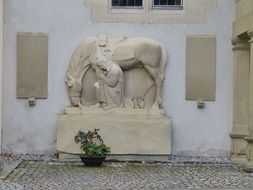 soldier with horse, stone sculpture in World War II memorial, germany, remstal