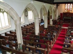 Hall with wooden benches in the Church of St. George