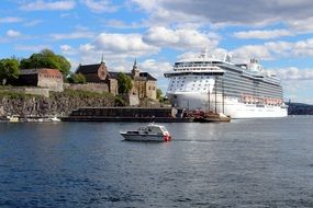 Cruise liner on the water near the fortress of Akershus in Oslo