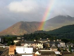 rainbow over a small town in the countryside