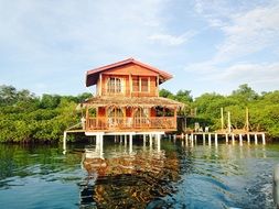 red house on water