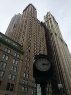 skyscraper with clock in manhattan