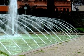 fountain water splashes into the pool