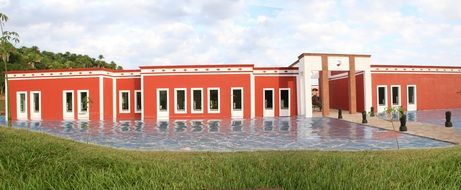 house with red walls near the pool