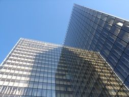 modern building mirroring facade, france, paris