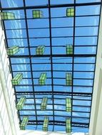 glass roof with yellow lanterns