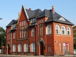 building with brown walls under blue sky