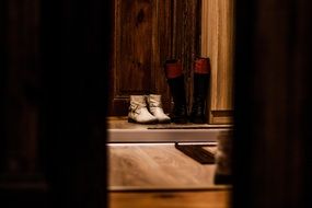 two pairs of boots on the threshold