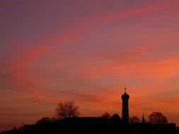 Church tower city red sunset