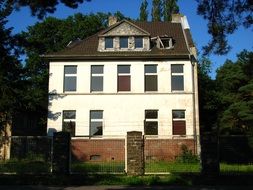 abandoned building behind fence