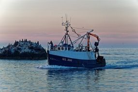 fishing boat end of the day in harbor