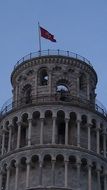 flag on the leaning tower of pisa