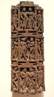 relief piece of clay wall with the image of people