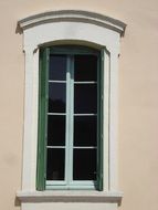 window with open green shutters