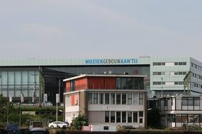 distant view of the building of muziekgebouw in amsterdam