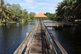 pavilion on wooden pier at lake