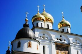 white russian church with golden onion domes