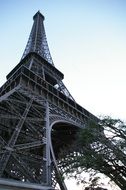 Eiffel tower and trees against the sky