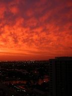 red clouds city sunset