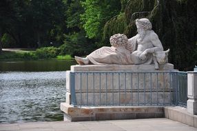 Sculpture near a pond in a park in Warsaw