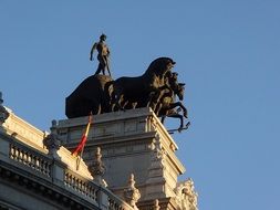quadriga statue against a blue sky