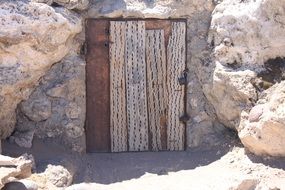 small wooden door of a stone dwelling