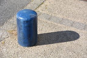 blue column on the sidewalk