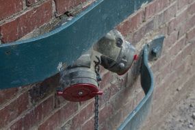 closeup picture of the pipe on a brick wall