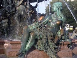 statue near the fountain at alexanderplatz in berlin