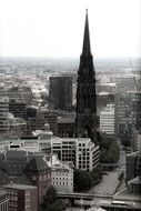 church steeple above buildings in city, black and white, germany, hamburg