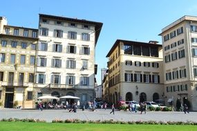 people and houses on the square in Florence