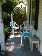 chairs on the porch of the building