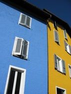 house with yellow and blue facade in switzerland