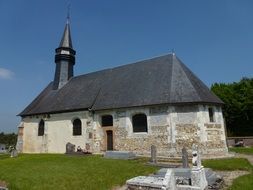 church on a green meadow in france