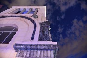 gargoyle statue on the facade of the building