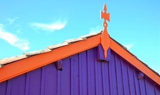 Violet and orange building with the roof