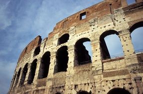 ruins of an ancient stone building, colosseum, rome