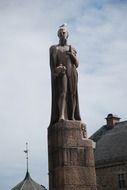 Stone monument with white bird on it