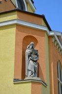 statue on the facade of the church of St. Barbara