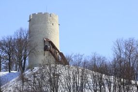 tower on a hill during a blizzard