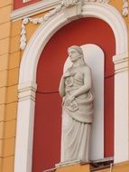 statue on the facade of the building in Romania