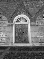 black and white photo of the door in the building