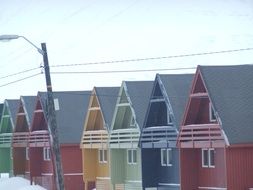 colorful houses in the norway snow