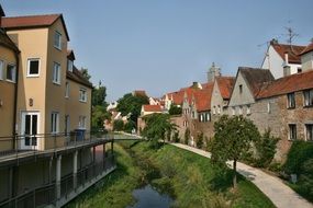 buildings along the banks of a small river in donauwörth
