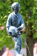 fountain in the form of a sculpture of a girl with a jug