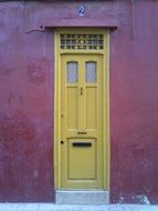 yellow wooden door on a building