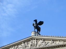 statue on a old opera's roof in frankfurt